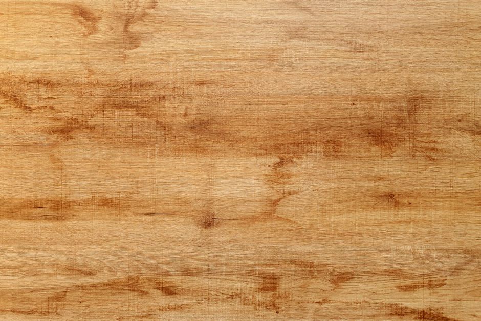 Detailed close-up of a natural hardwood texture, showcasing grain and pattern.